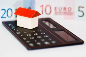 Casa em Cima de Calculadora